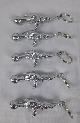 six silver spoons are lined up in a row on a table