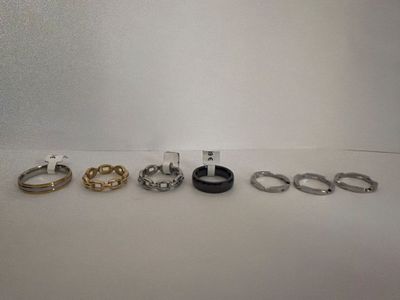 four different types of rings are shown on a white surface