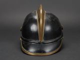 a black helmet with gold accents on a gray background
