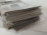 a stack of newspapers sitting on top of a table