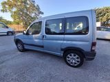 an image of a silver van parked in a parking lot