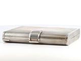 an image of a silver box with a handle on a white surface
