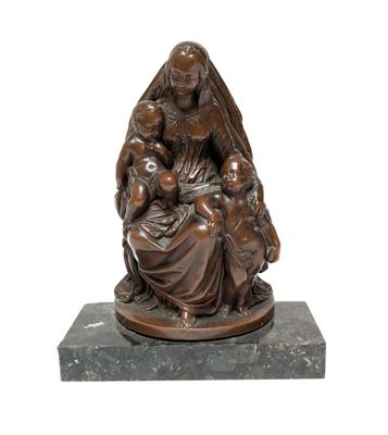 an image of a statue of a woman holding a child