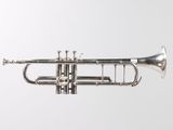 a close up of a silver trumpet on a white background