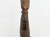 statue of a hand with a hole in the middle of it