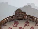 a shadow of a person on the wall behind a chair