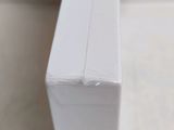 a close up of a piece of white paper on a table