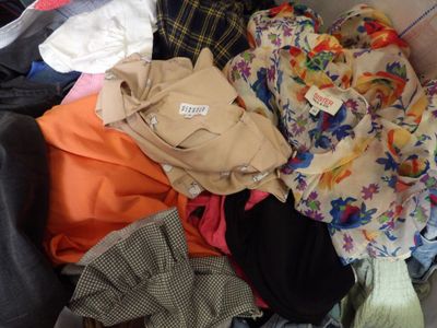 a pile of clothes that is sitting in a box