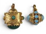 two pieces of gold and turquoise jewelry on a white surface