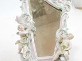 a small mirror that is sitting on a table