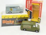 a green toy van and a box of other toy cars