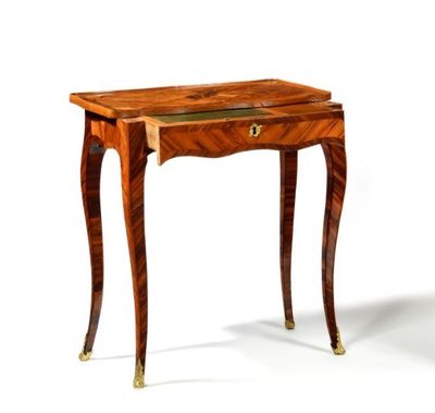 a small wooden table with a drawer on top of it