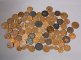 a pile of coins on a table with a white background