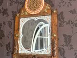 a mirror on the wall above a sink in a bathroom