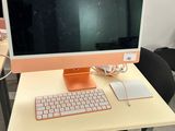 a computer on a desk with a keyboard and mouse