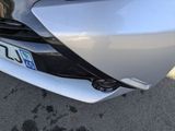 a close up of the front of a car with a license plate on it