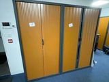 a room with a bunch of yellow doors and a blue carpet