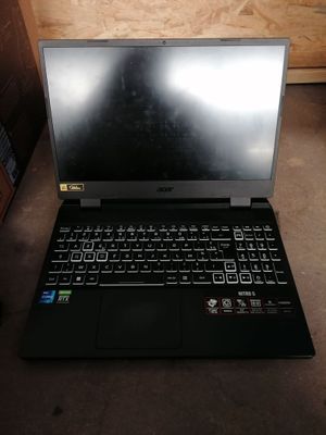 a laptop that is sitting on the floor in the room