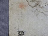 a drawing of a man ' s head on a piece of paper