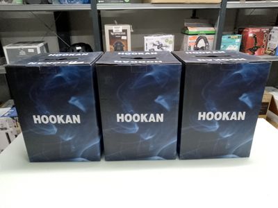 three boxes that are sitting on a table in a store