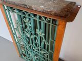a small table with a marble top and a wooden base