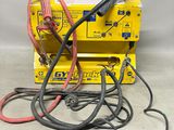 a yellow box with a bunch of wires on top of it