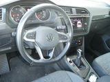 the interior of a car with a steering wheel and dashboard controls