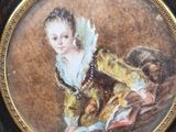 painting of a woman in a yellow dress holding a dog in a black bowl