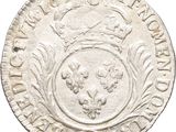 a silver coin with a crown on top of it