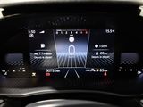 the dashboard of a car with a digital display on it