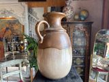 a vase sitting on top of a table in a room