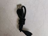 a usb cable that is connected to a small device