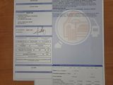 a receipt on a table with a picture of a car