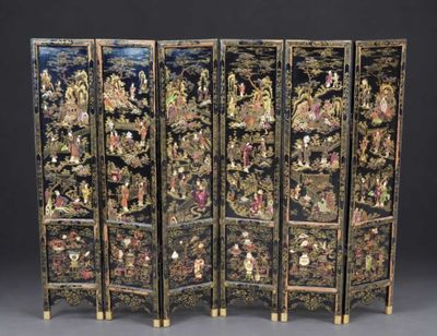three black and gold decorated screens with figures on them