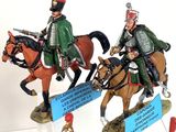 five figurines of soldiers riding horses on display