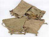 several old military items are sitting on a white surface