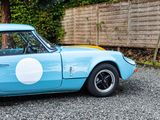 a blue car with a white circle on the side of it