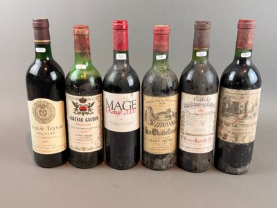 several bottles of wine are lined up on a table