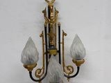 a wall light that is hanging on the wall