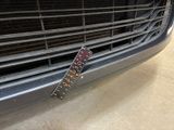 a remote control attached to the front of a car