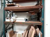 a room with a lot of shelves and a refrigerator