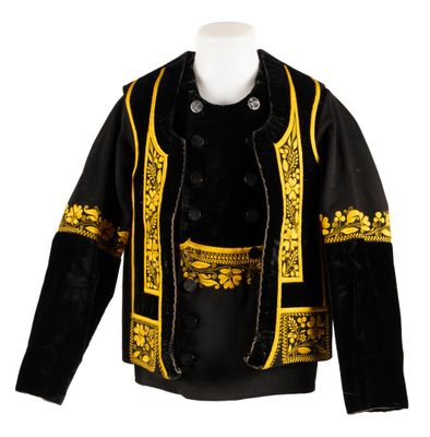 a black and gold jacket with gold trimmings on a mannequin head