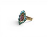 a gold ring with turquoise and pink stones