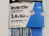a pack of screws in a package on a white surface