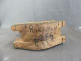 a piece of wood that has writing on it