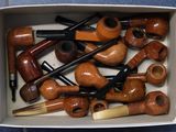 a box full of different types of pipe smokings