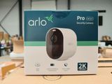 an image of an arlo pro camera in a box on a table