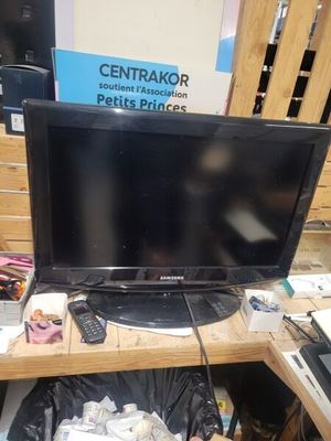 a television that is sitting on a desk in a room