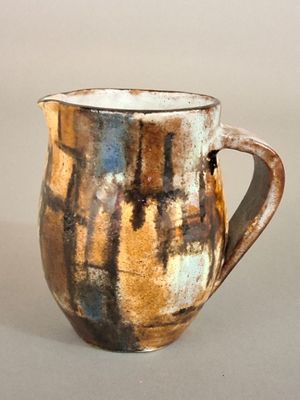 a close up of a coffee cup on a table