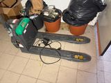 a picture of a forklift in a room with trash